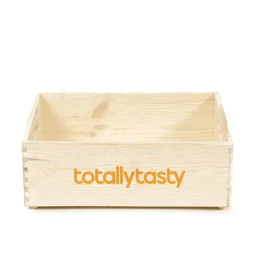 Wooden crate with 'totallytasty' logo on a white background
