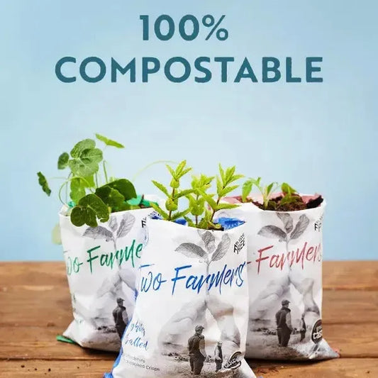 Picture of Two Farmers Crisps packet showing they're 100% compostable with plants growing out of them.