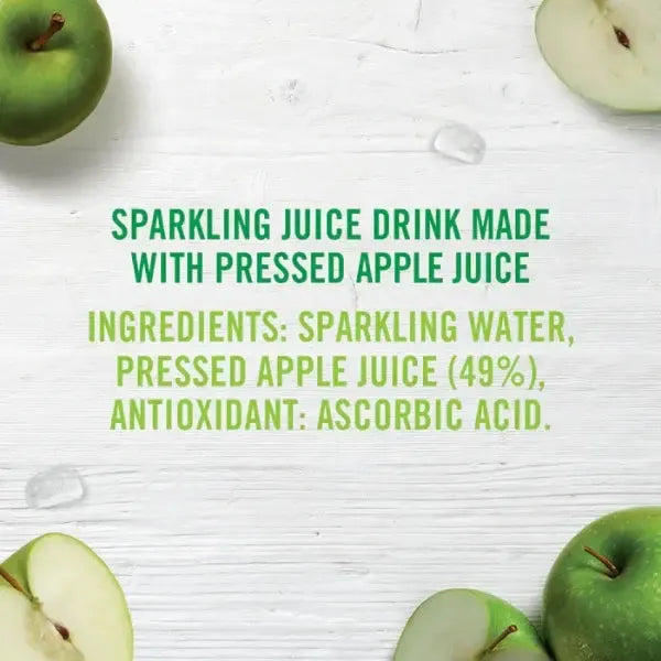 Ingredients of a sparkling juice drink made with pressed apple juice on a white background with green apples.