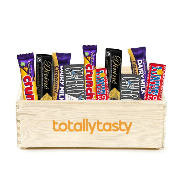 A pine open top box containing an assortment of chocolate bars on white background