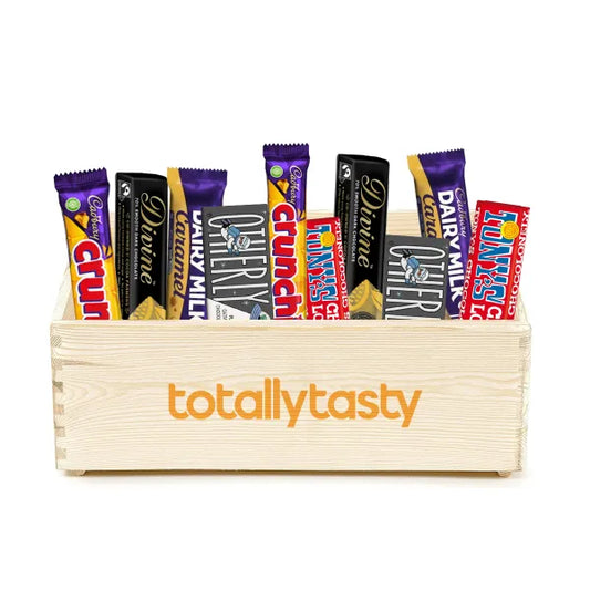 A pine open top box containing an assortment of chocolate bars on white background