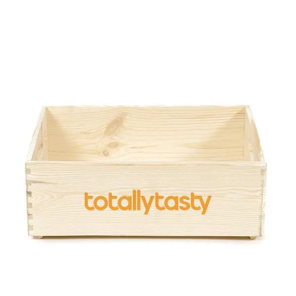 Wooden crate with 'totallytasty' logo on a white background