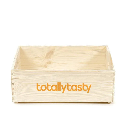 Wooden crate with 'totallytasty' logo on a white background