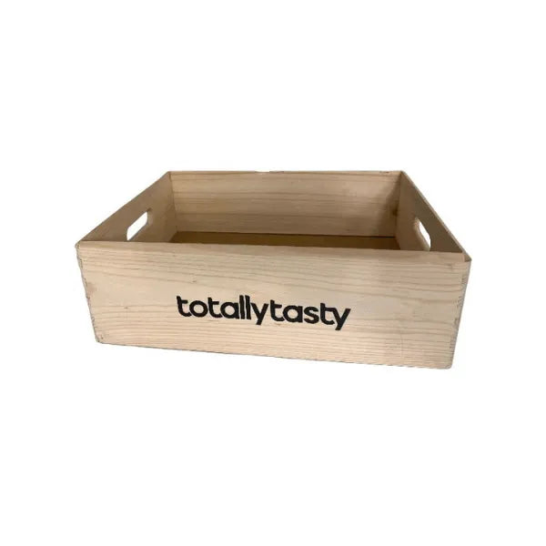 Wooden crate with 'totallytasty' branding on a white background