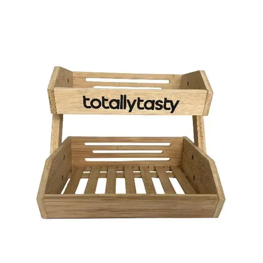 Wooden fruit basket with 'totallytasty' branding on a white background