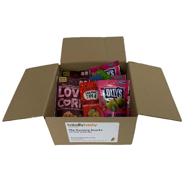 Open cardboard box with snacks on a white surface