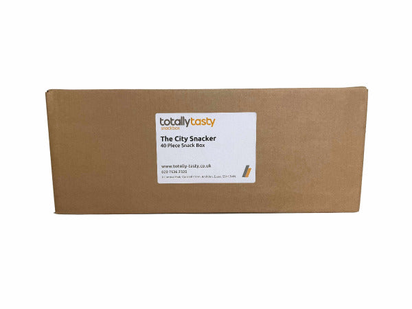 Cardboard box with 'totally tasty' label on a white surface