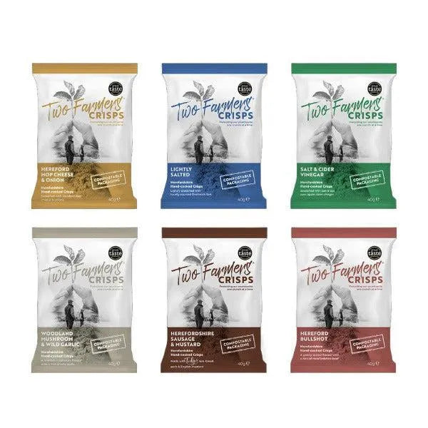 Six packages of Two Farmers Crisps with different flavours on a white background
